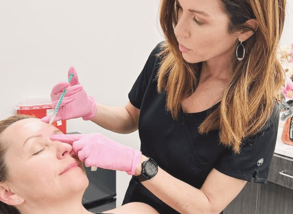 Image showing female patient being injected with botox by female doctor